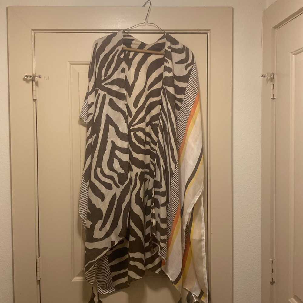 Beautiful brown and tan Zebra print tan and brown kimono!  Has side slits!